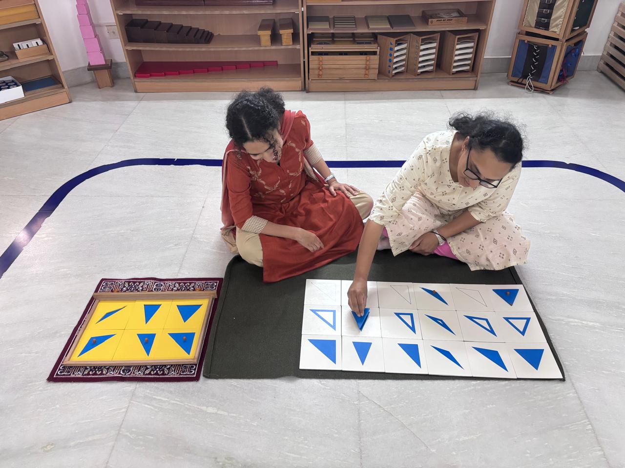 Montessori trainee sorting blue triangle cards during practical teacher training